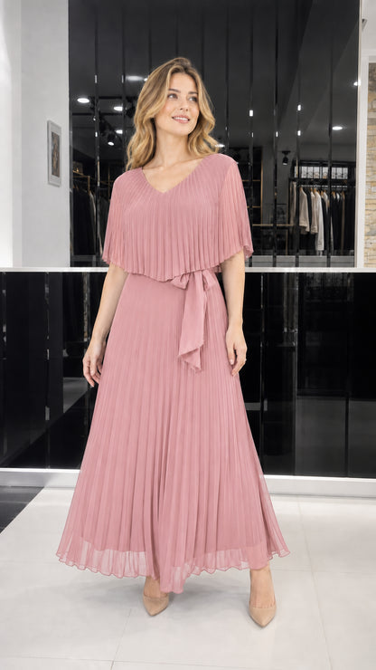 Model wearing dusty rose pleated cape overlay maxi dress