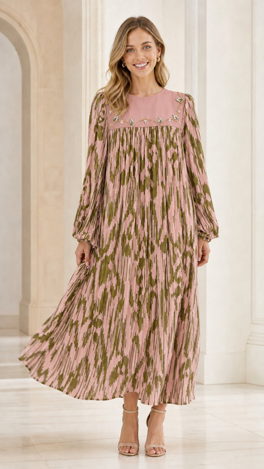 Woman wearing dusty pink pleated long sleeve maxi dress