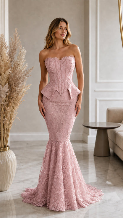 Front view of model wearing blush pink strapless lace corset mermaid evening gown