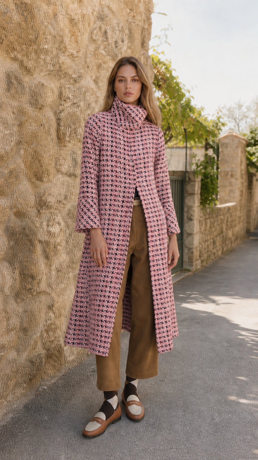Model wearing blush pink textured tweed stand collar long coat