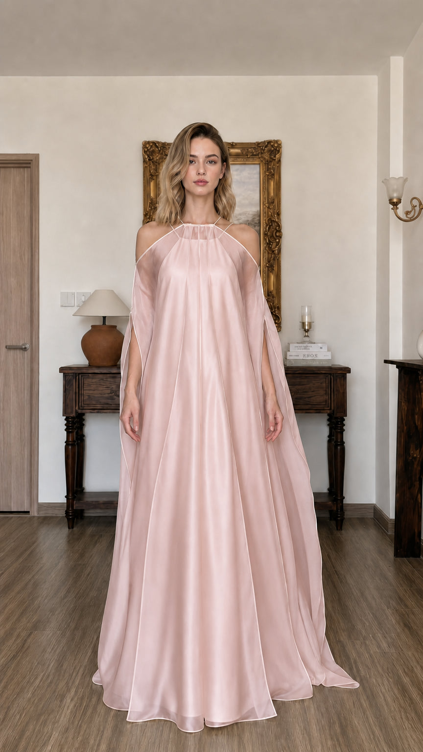 Model wearing blush pink cold-shoulder maxi dress