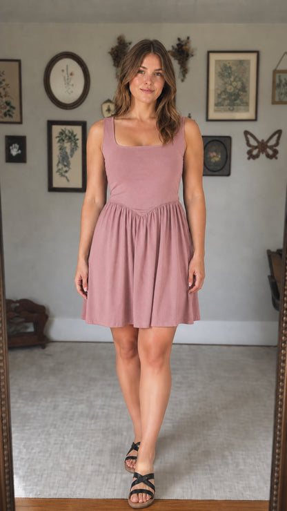 Front view of woman wearing dusty rose mini dress