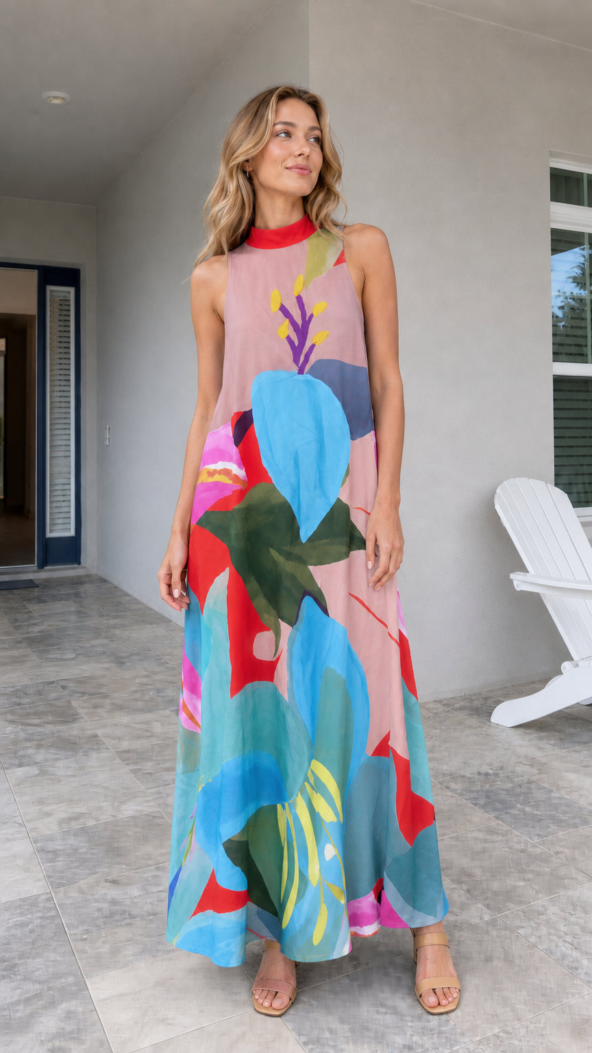 Model wearing pink tropical print maxi dress