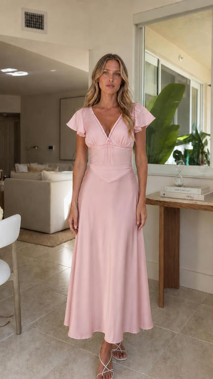Woman wearing pink V-neck midi dress