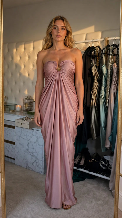 Model wearing pink satin strapless draped evening dress