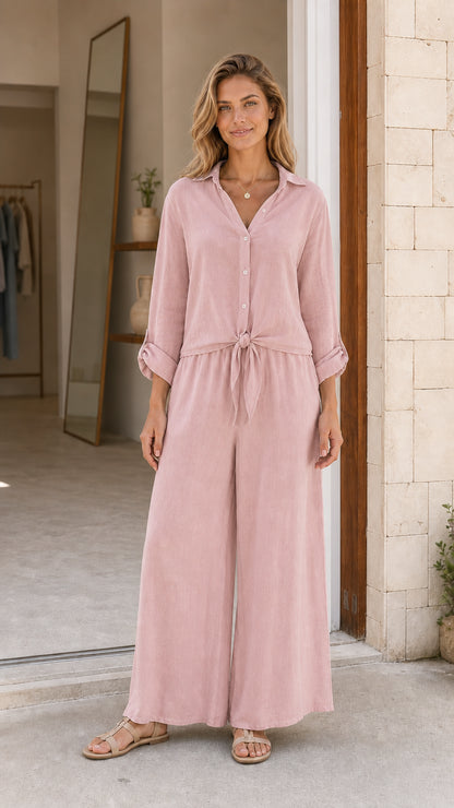 Front view of pink button-down wide leg jumpsuit