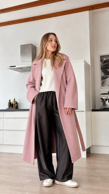 Model wearing dusty pink longline wrap coat