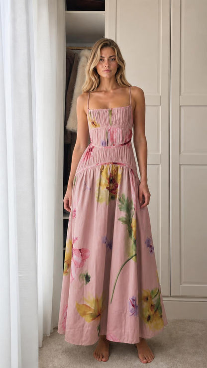Model wearing pink floral print smocked maxi dress