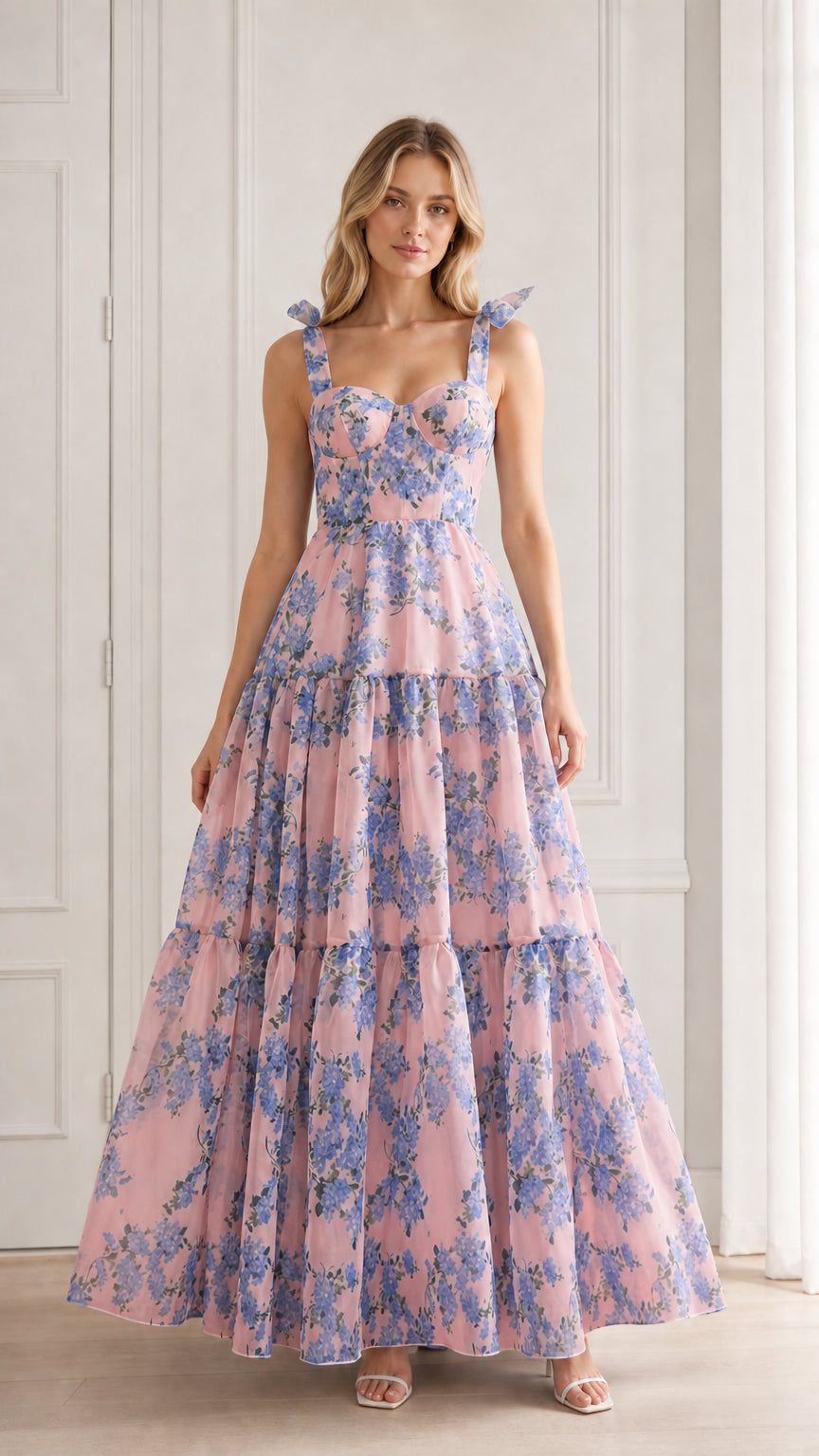 Model wearing pink floral tiered maxi dress