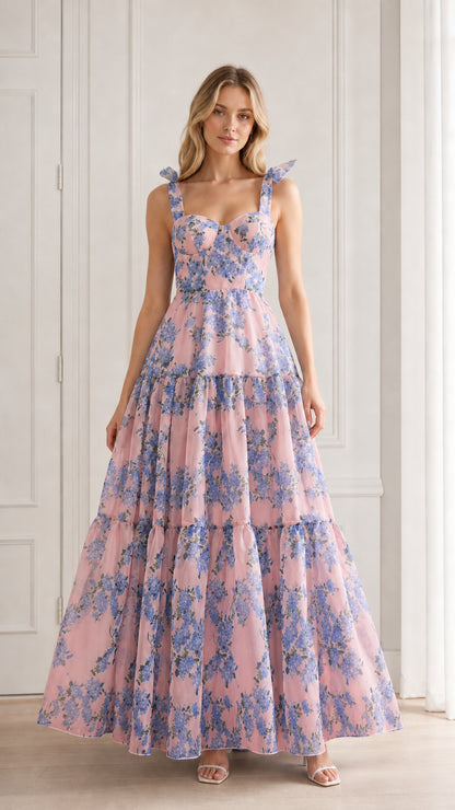 Model wearing pink floral tiered maxi dress