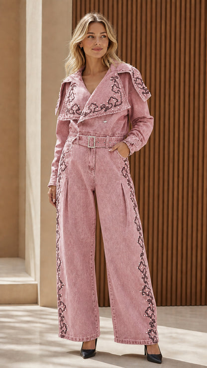 Model wearing pink embroidered denim jumpsuit