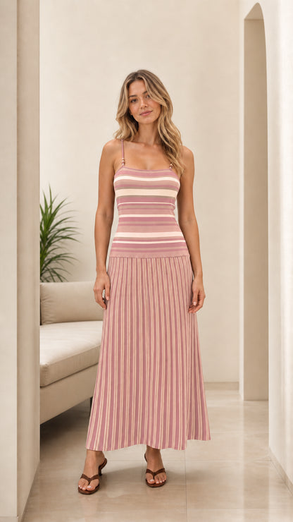 Woman wearing pink and cream striped knit sleeveless maxi dress