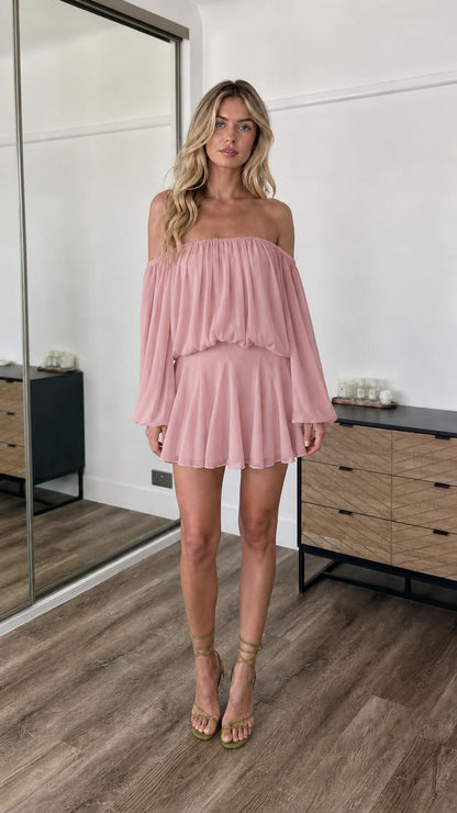 Front view of model wearing dusty pink off-the-shoulder mini dress