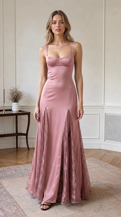 Full-length front view of dusty rose satin bustier maxi dress with lace godets