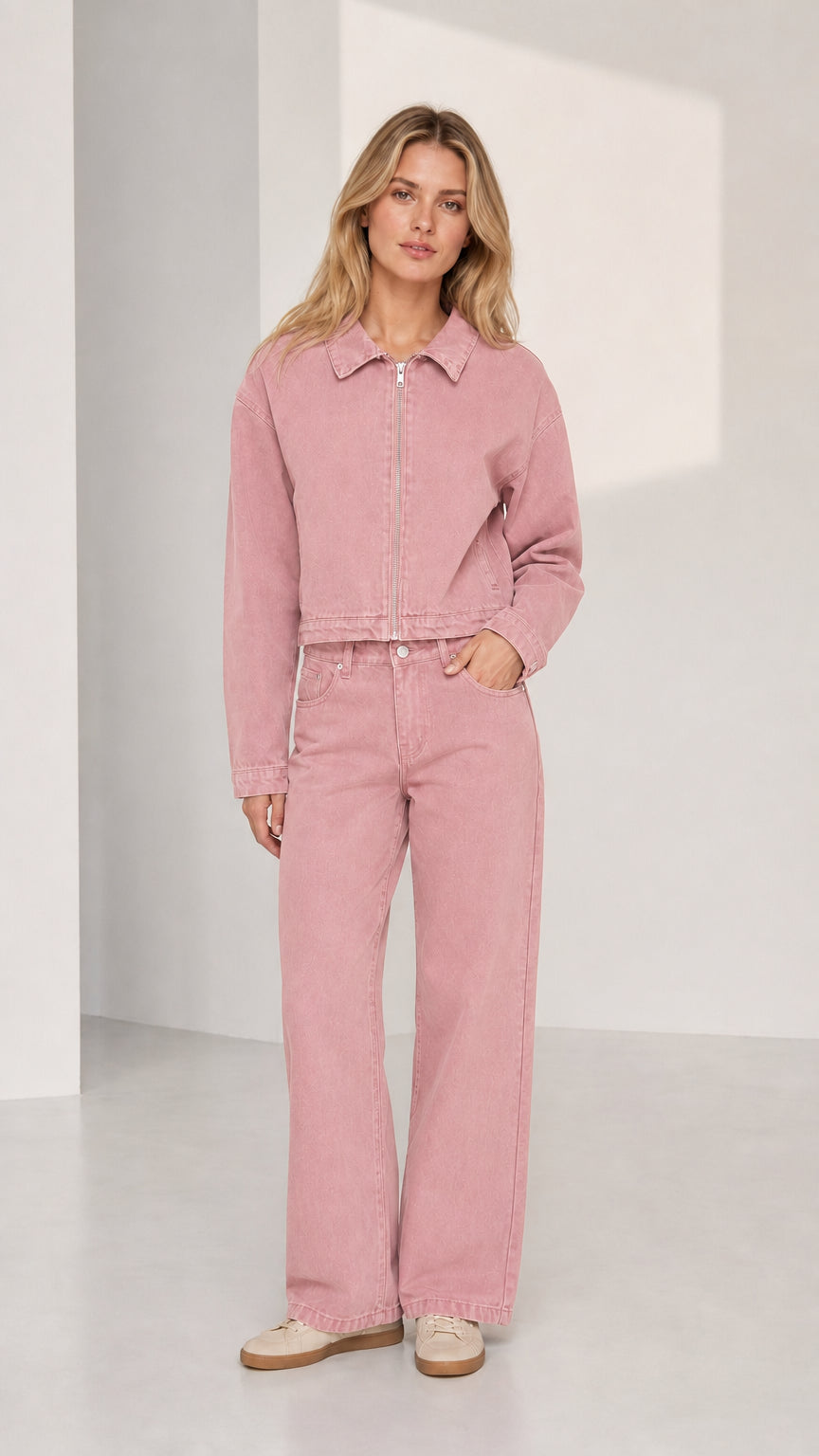 Woman wearing pink denim jacket and wide-leg pants set