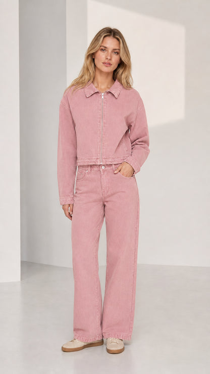 Woman wearing pink denim jacket and wide-leg pants set