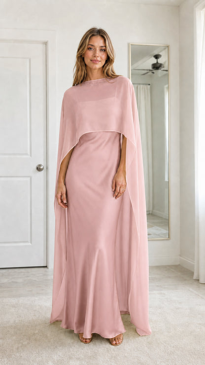 Front full view of woman wearing Blush Pink chiffon cape evening dress