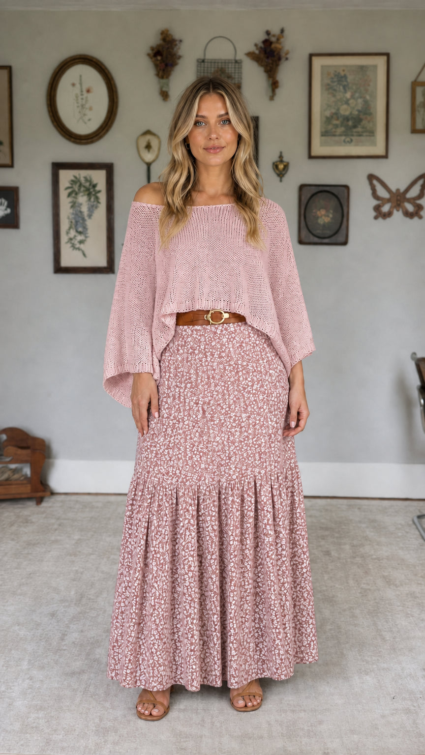 Model wearing pink off-the-shoulder knit top and pink floral maxi skirt set
