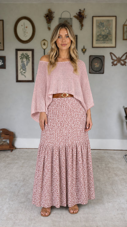 Model wearing pink off-the-shoulder knit top and pink floral maxi skirt set