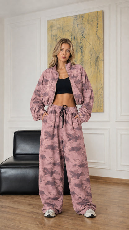 Model wearing dusty pink camouflage cropped jacket and baggy drawstring pants set