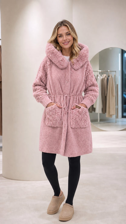 Front full-length view of woman wearing dusty pink hooded plush fleece coat