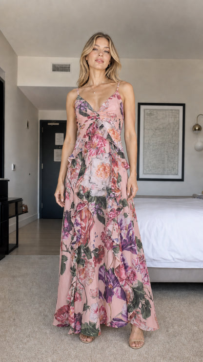 Model wearing pink floral print ruffle maxi dress