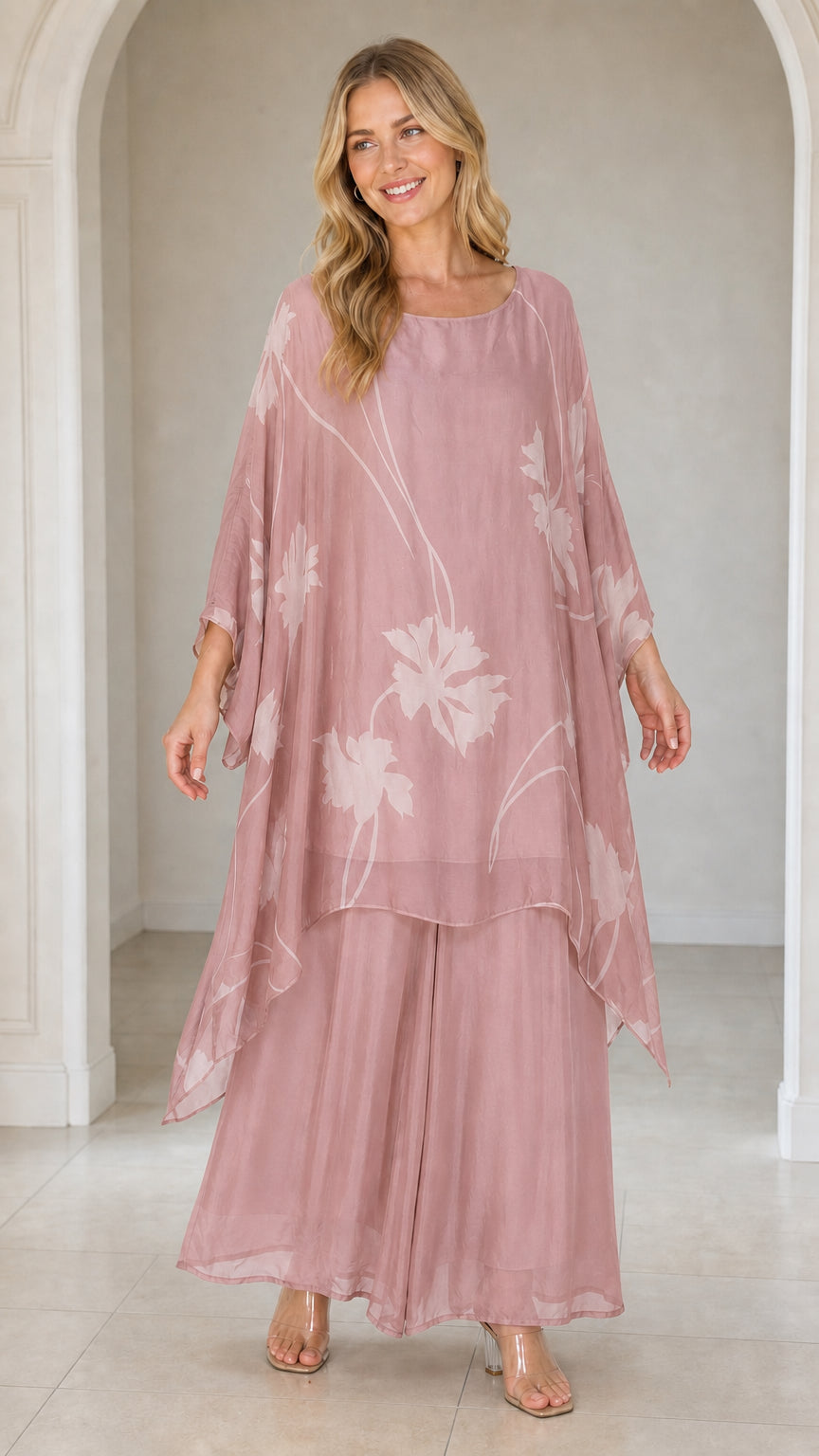 Front view of woman wearing dusty rose floral kaftan set