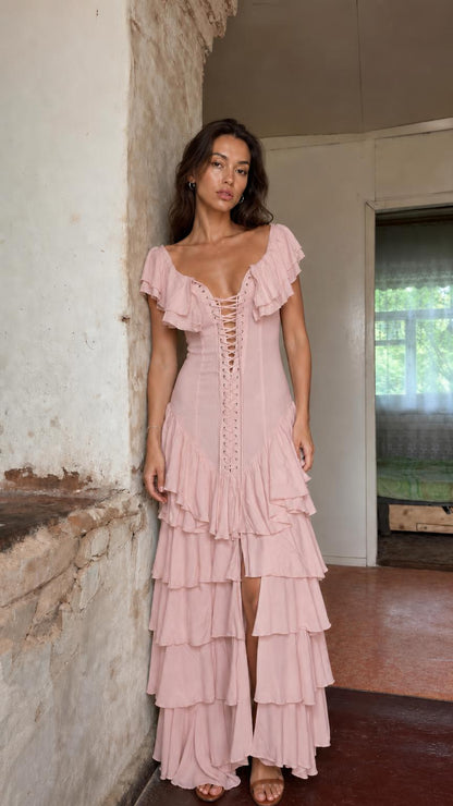 Front view of model wearing pink ruffle tiered maxi dress
