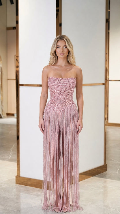 Model wearing pink color variant of crystal fringe evening gown