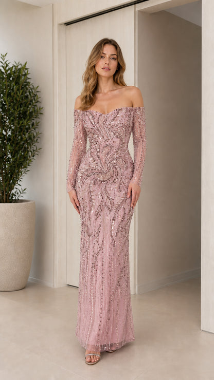 Front view of blush pink off-the-shoulder long sleeve embellished formal gown