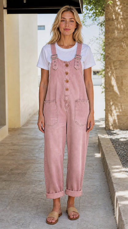 Front view of model wearing pink denim overalls