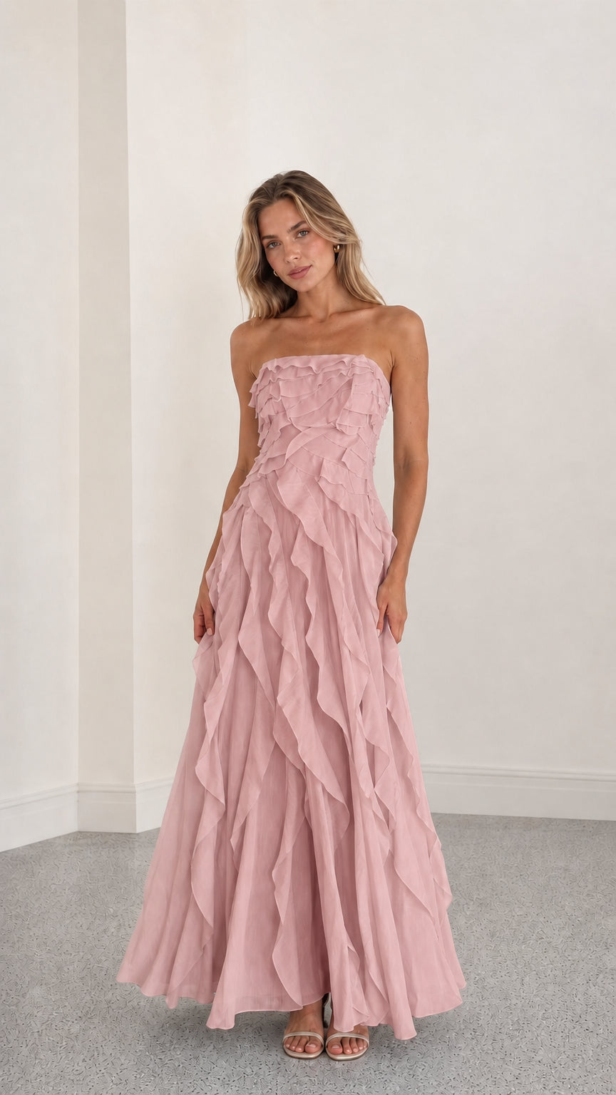 Full length view of pink strapless ruffle maxi dress