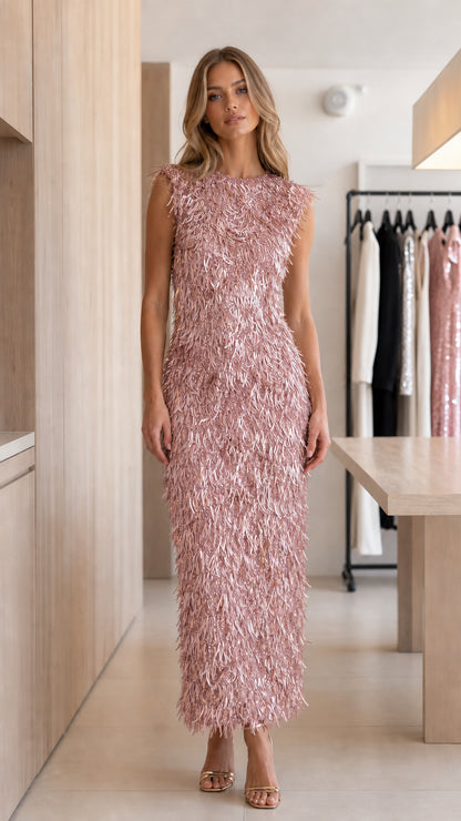 Model wearing blush pink sleeveless fringe sequin column maxi dress front view