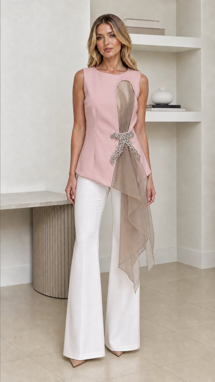 Front view of woman wearing pink color variant of the asymmetric top