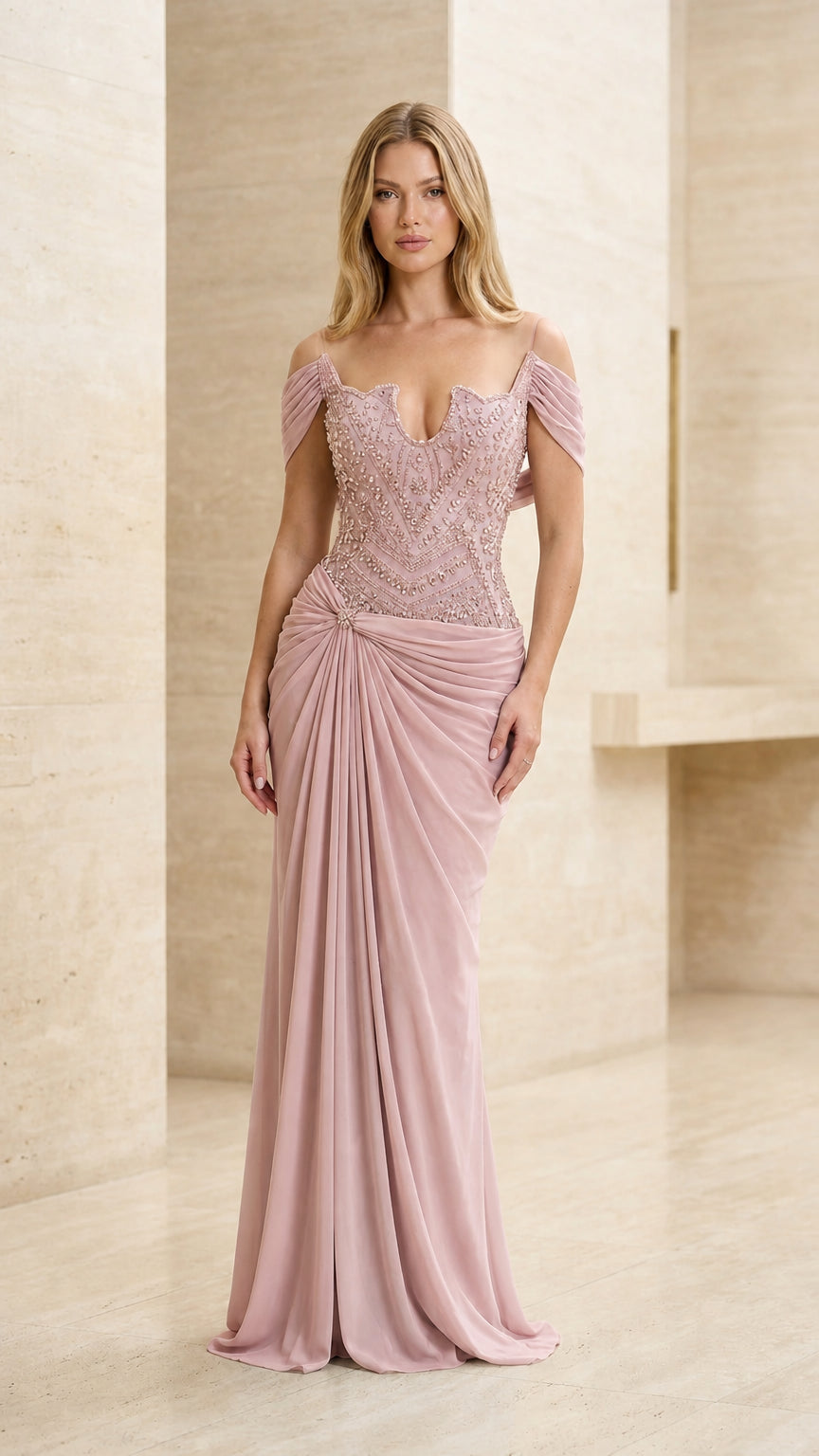 Model wearing dusty rose pink beaded off-the-shoulder formal gown