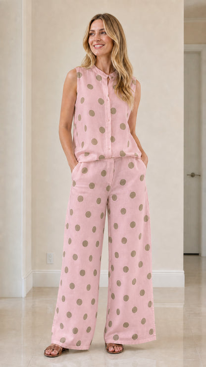 Woman wearing pink polka dot two-piece set