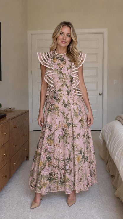 Woman wearing pink floral ruffle maxi dress