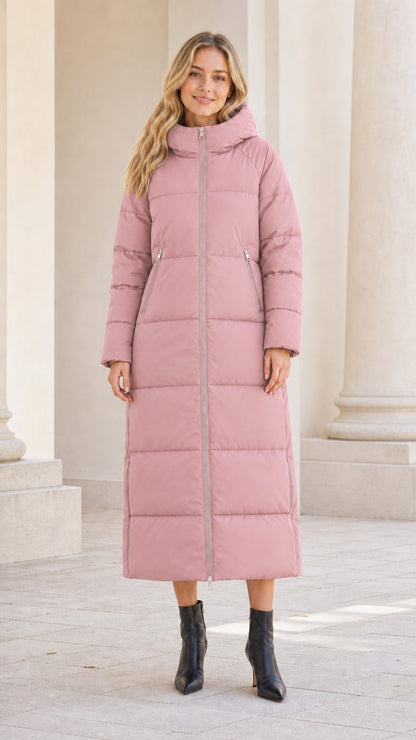 Front full-length view of model wearing dusty pink maxi quilted puffer coat