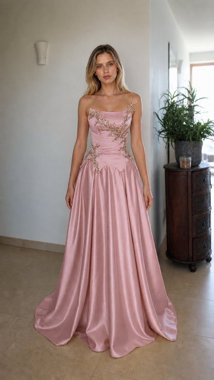 Front view of pink strapless beaded corset evening dress