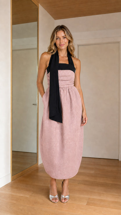Front view of woman wearing dusty pink contrast halter tie cocoon midi dress
