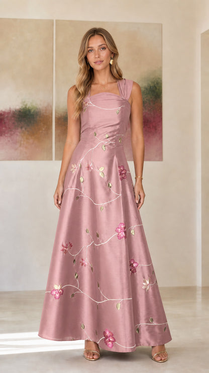 Model wearing dusty rose embroidered floral evening dress