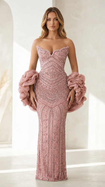 Front view of blush pink beaded evening gown