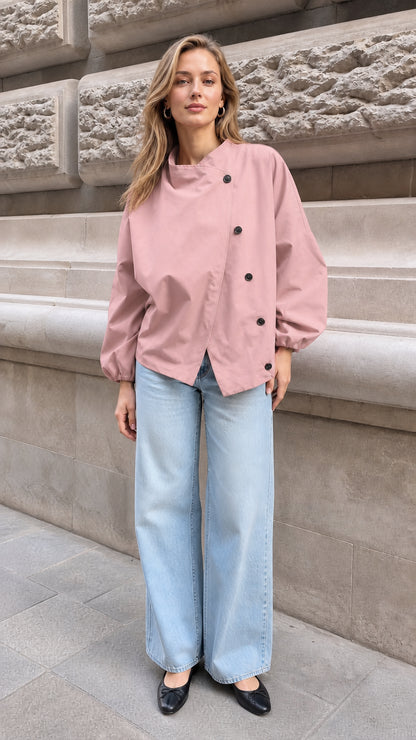 Model wearing the dusty pink asymmetrical button stand collar blouse