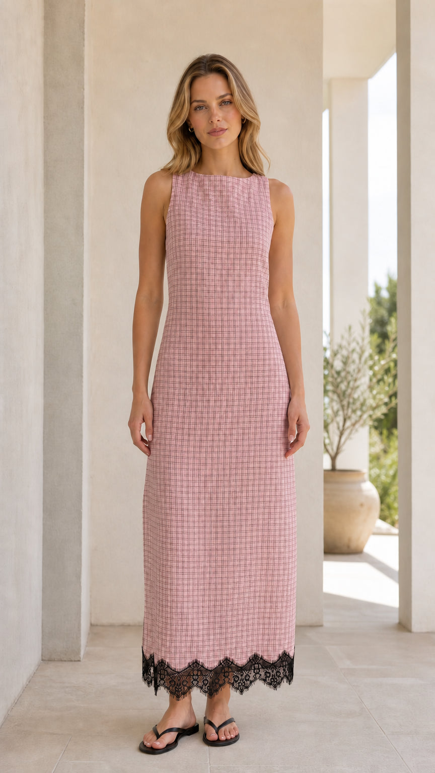Front view of model wearing pink gingham midi dress