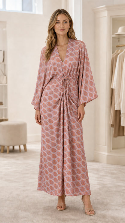 Model wearing pink geometric print maxi dress