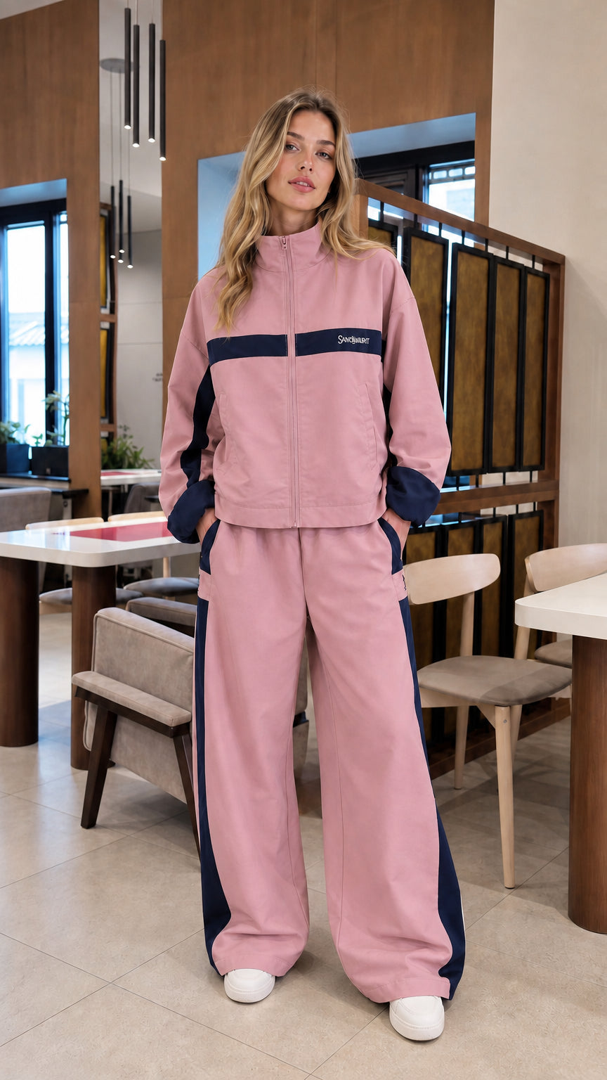 Dusty pink colorblock zip-up jacket and wide-leg tracksuit set on model