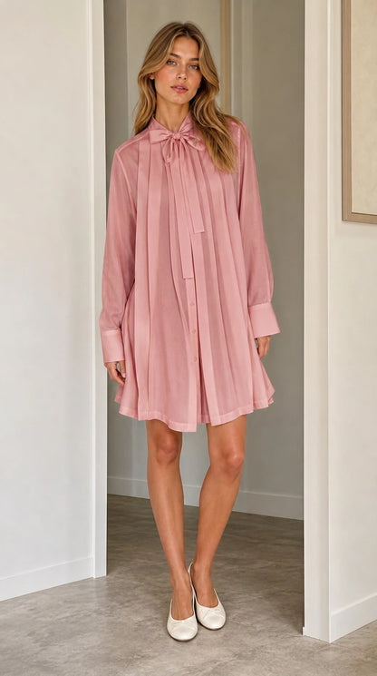 Front full view of pink pleated shift dress