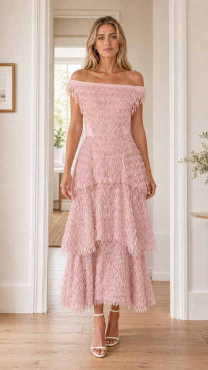 Front view of woman in pink off-the-shoulder fringe dress