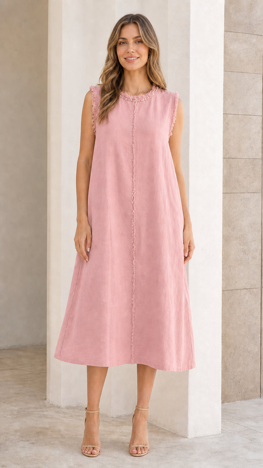 Front view of woman wearing pink sleeveless midi dress