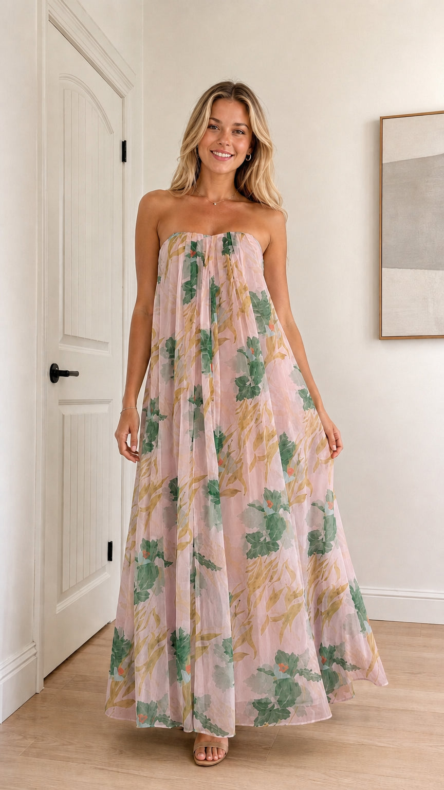 Model wearing pink floral strapless maxi dress